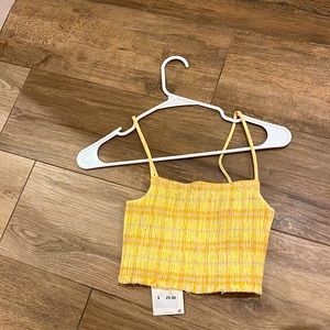Woman’s yellow top